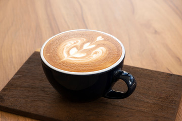 Hot coffee on a wooden table