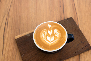 Hot coffee on a wooden table