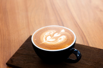 Hot coffee on a wooden table