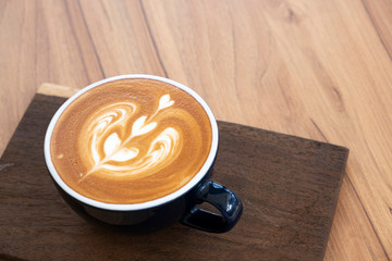 Hot coffee on a wooden table