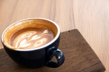 Hot coffee on a wooden table