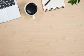 Flay lay, Top view office table desk with computer laptop, keyboard, coffee, pencil, leaves with copy space wood background.