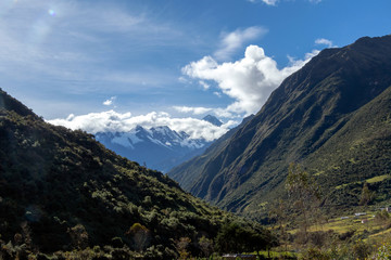Fototapeta na wymiar Green mountains with snow covered peaks, Andes, Peru