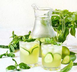 cold drink with basil, cucumber and lime. Mojito, lemonade with basil.