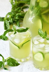 cold drink with basil, cucumber and lime. Mojito, lemonade with basil.