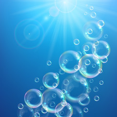 Realistic transparent floating soap bubbles with rainbow reflection. Design element for advertising booklet, flyer or poster