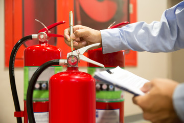 Fire extinguishers, Engineers are checking fire extinguishers.