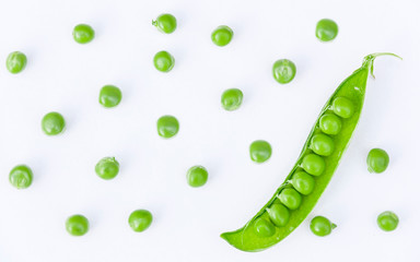 green pea pods and peas as background