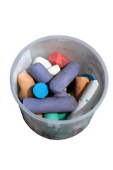 Colorful chalks in plastic container isolated on background