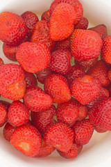 bowl with strawberries isolated on white