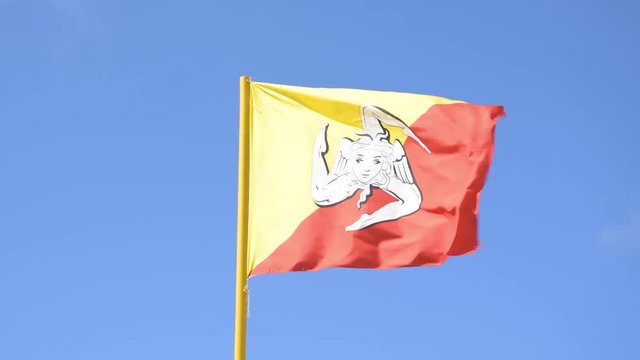 Sicilian flag in bright day and high wind