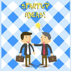 Handwriting text Startup Ideas. Conceptual photo Concept that can be used for financial gain of business Two White Businessmen Colleagues with Brief Cases Sharing Idea Solution