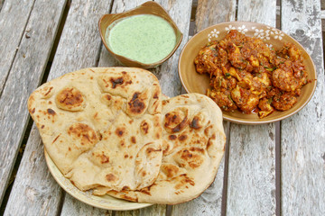 Veiw of Tava Chicken with green raita chutney