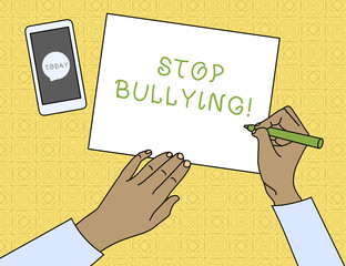 Conceptual hand writing showing Stop Bullying. Concept meaning stop the aggressive behaviour among school aged children Top View Man Writing Paper Pen Smartphone Message Icon
