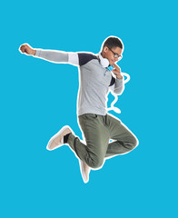 Fototapeta na wymiar Portrait of jumping African-American teenage boy on white background