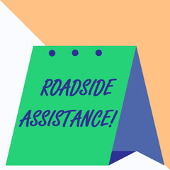 Writing note showing Roadside Assistance. Business concept for helps drivers when their vehicle breaks down on the road