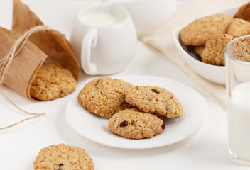 Sweet oatmeal cookies with nuts on the plate
