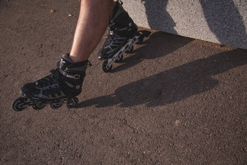 man with inline skates skating on the street