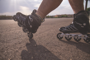 man with inline skates skating on the street