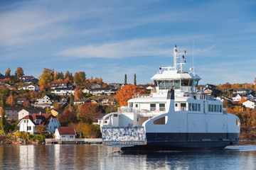 White ferry enters the port of Norwegian town