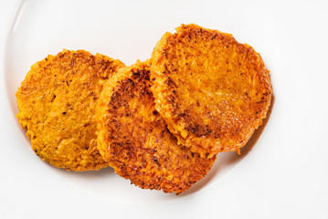 carrot pancakes on the white plate