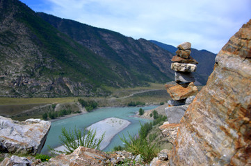 Socral pyramid on the top of the mountain, against the background of the bend of the turquoise...