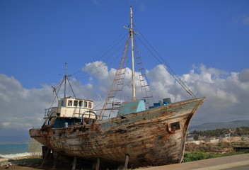 old beautiful ship on sea bank