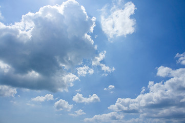 Beautiful blue sky with white clouds above the sea on a sunny summer day