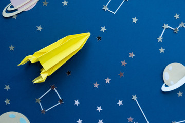 Paper homemade origami rocket. Original Space concept