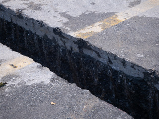 workers are installing concrete drains on the side of the road