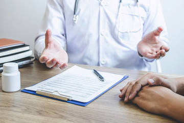 Doctor consulting with patient examining for patient, presenting results symptom about the problem and recommend treatment method, Healthcare and medical concept