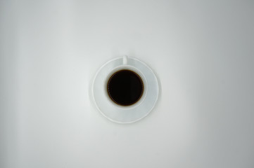 White cup of coffee on white background