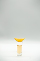 Shot with piece of orange on white background