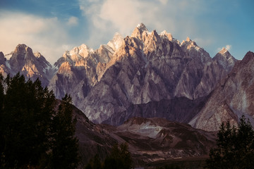 Beautiful scenery of sunset at Passu. Massif mountain peak of Passu Cones in Karakoram range, Gojal Hunza. Gilgit Baltistan, Pakistan.