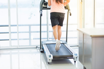 leg of asian woman running on machine,workout and exercise lifestyle.