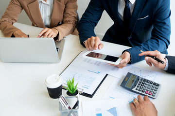 Business People Talking Discussing with coworker planning analyzing financial document data charts and graphs in Meeting and  successful teamwork Concept.