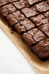 Homemade chocolate brownies, side view. Copy space.