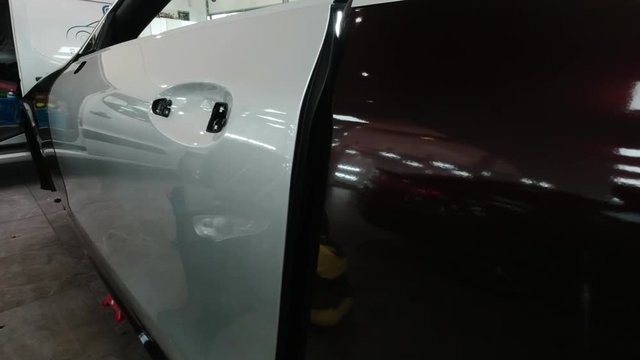 Vinyl wrap application before and after on silver car