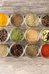 Various kinds of colourful seasonings in bowls. Collection of spices