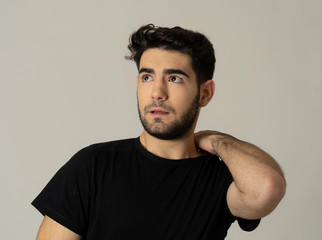 Obraz premium Human expressions and emotions Worry. Young attractive man thinking and looking up wondering.