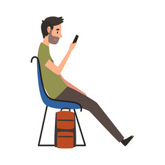 Fototapeta premium Young Man in Casual Clothes Waiting at Airport Terminal for Flight, Guy Sitting on Chair with Smartphone at Waiting Room Vector Illustration
