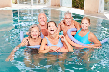 Vital group of seniors in the swimming pool