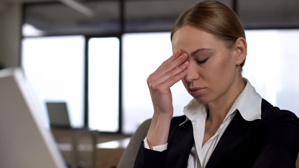 Young employee suffering headache, tired of complex project, overwork concept