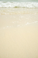 Tropical beach with white coral sand and calm wave with space for text background                   
