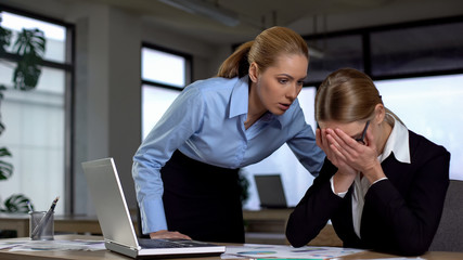 Boss shouting at frustrated employee, bullying and emotional abuse at work
