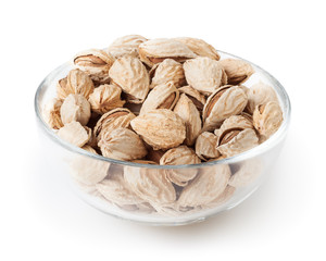 Almond nuts in glass bowl isolated on white background with clipping path