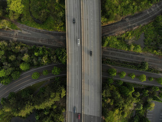 Fototapeta premium Photo of a road junction with cars and landscape top view, texture for design