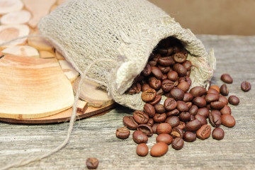 Coffee beans. Roasted coffee beans in a coarse woven bag.
