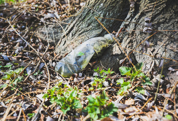 Litter in the nature. Plastic bottles. Pollution of the environment. Ecological disaster.