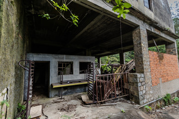 Fototapeta na wymiar Abandoned farm facilities at the Our Lady of Joy Abbey, Lantau Island, Hong Kong